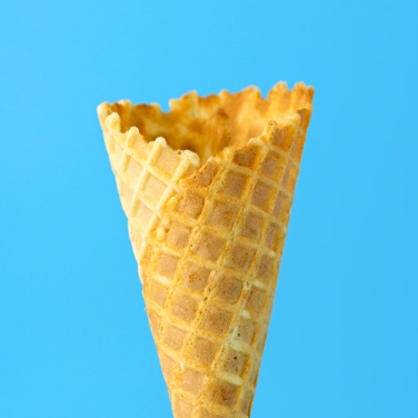 an empty ice cream cone on a blue background